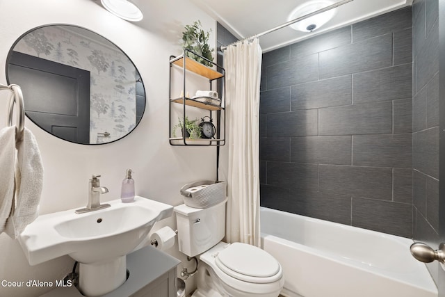 full bathroom with toilet, sink, and shower / bath combo with shower curtain