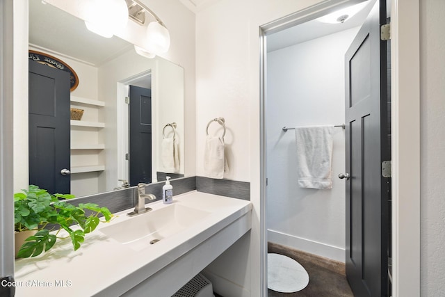 bathroom with sink and built in features