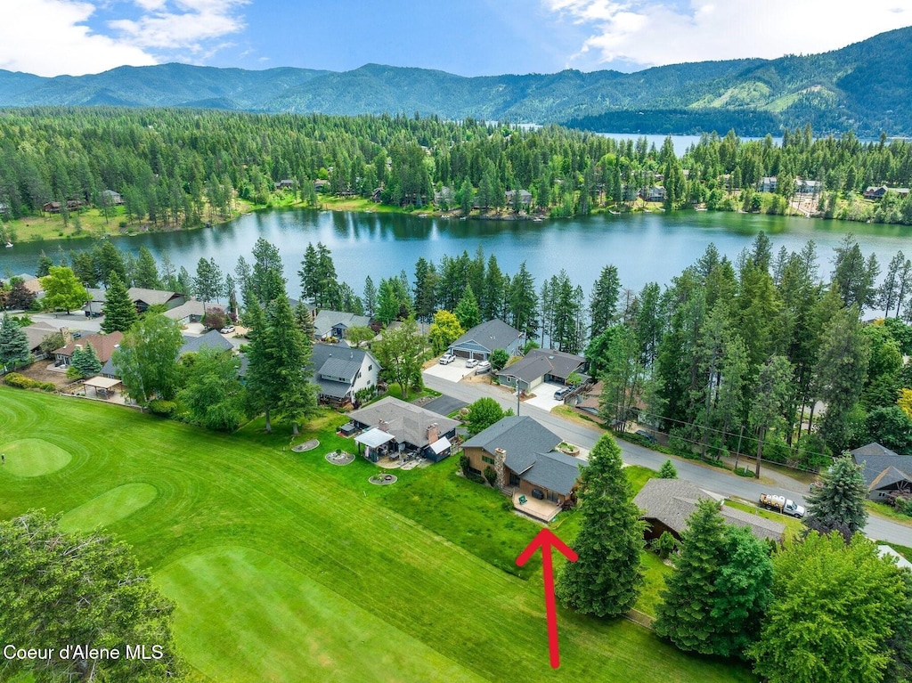 aerial view featuring a water and mountain view