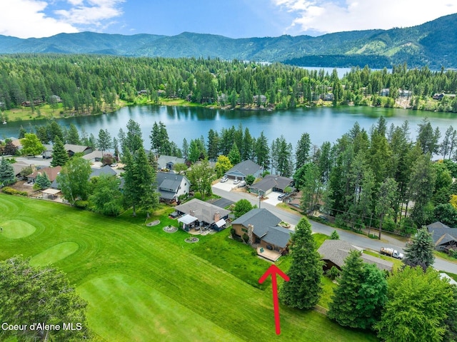 aerial view featuring a water and mountain view