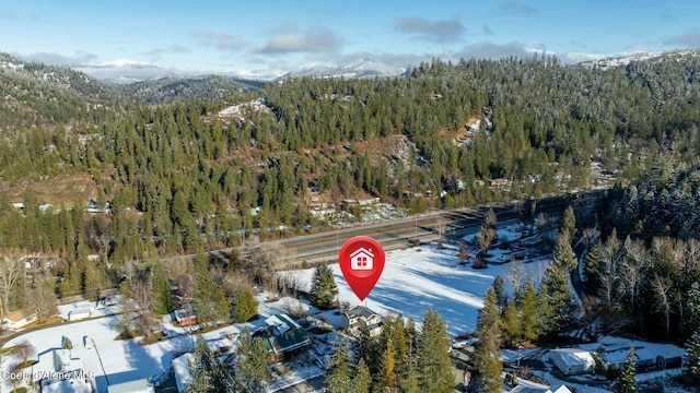 birds eye view of property with a mountain view