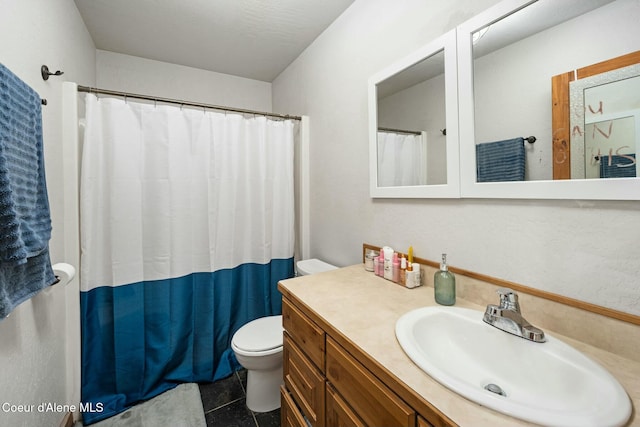 bathroom with toilet, tile patterned flooring, and vanity