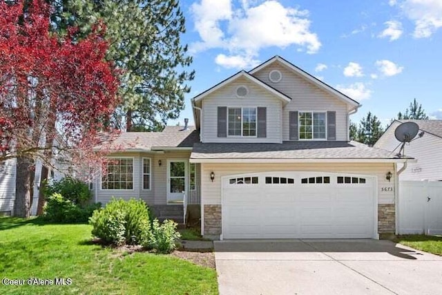 view of front facade with a front lawn and a garage