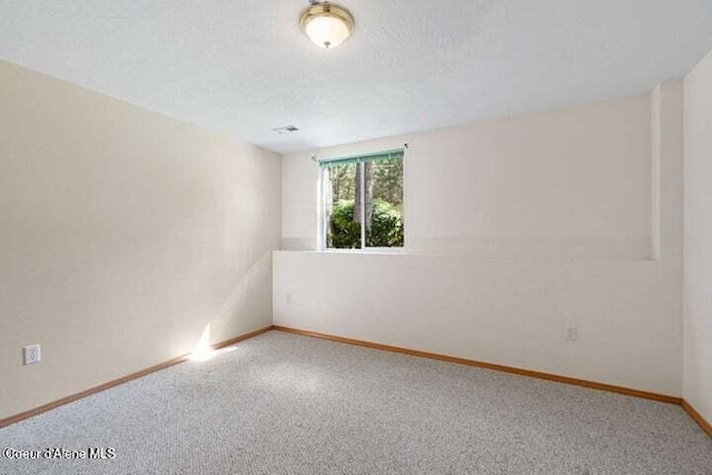 unfurnished room with carpet flooring