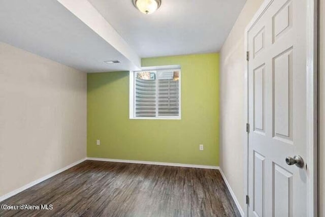 empty room featuring dark hardwood / wood-style floors