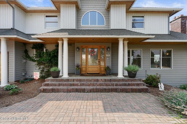 entrance to property featuring a porch