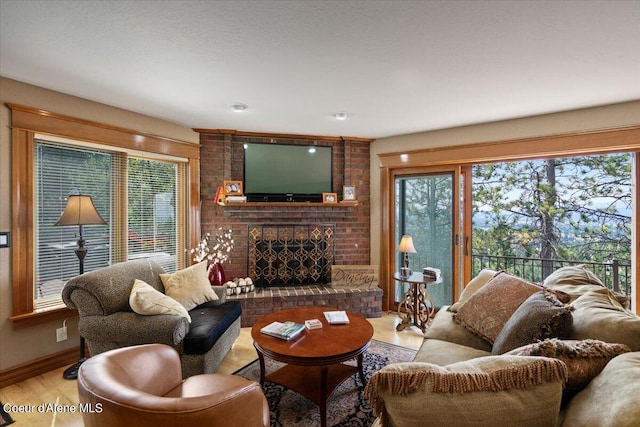 living room featuring light wood-type flooring and a brick fireplace