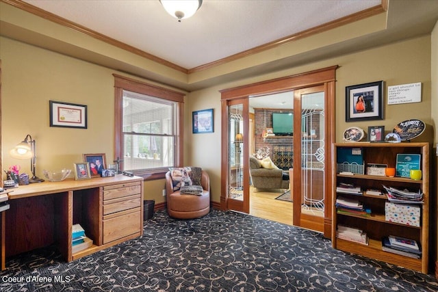 office featuring ornamental molding, french doors, and a fireplace