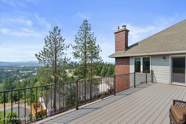 wooden deck featuring a mountain view