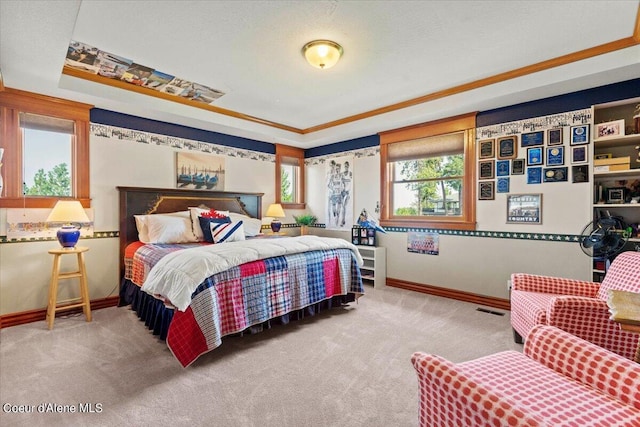 carpeted bedroom with ornamental molding