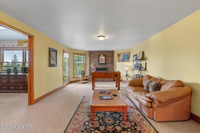 carpeted living room with a fireplace