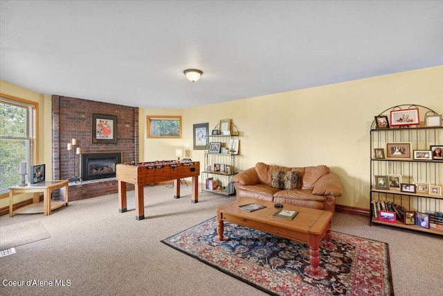 living room featuring carpet floors and a brick fireplace