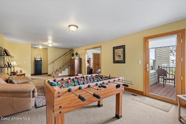 game room featuring light carpet