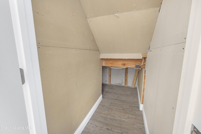 interior space featuring lofted ceiling and hardwood / wood-style flooring