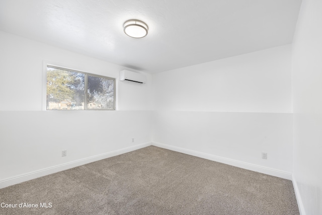 unfurnished room featuring an AC wall unit and carpet