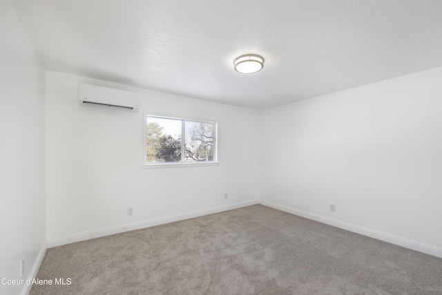 empty room with carpet floors and a wall mounted air conditioner