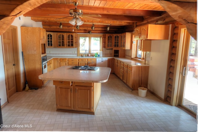 kitchen with sink, a center island, white appliances, wood ceiling, and beam ceiling