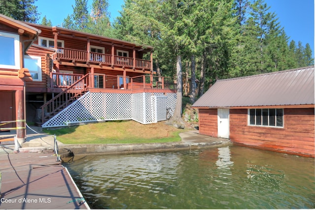 view of dock with a deck with water view