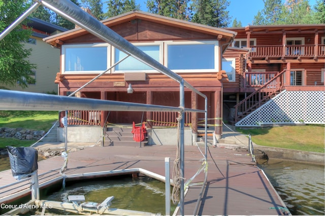 back of house featuring a water view