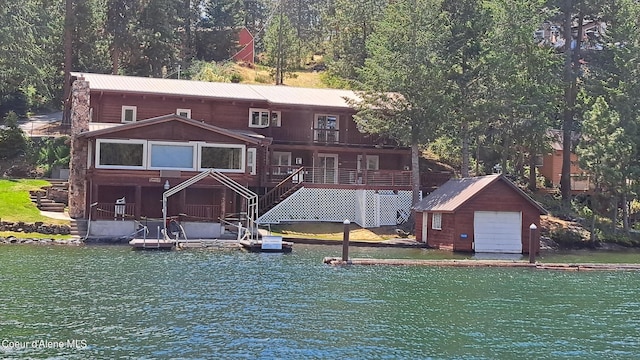 back of house featuring a water view