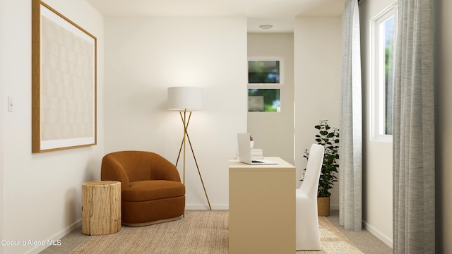 sitting room featuring light colored carpet