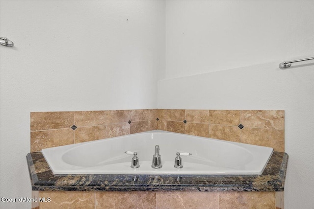 bathroom featuring a relaxing tiled tub