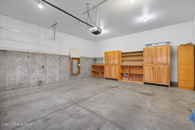 garage with electric panel and a garage door opener