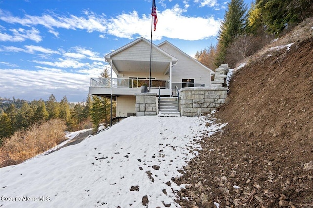 view of snow covered house