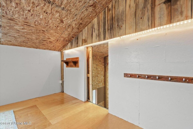 interior space with wood-type flooring and lofted ceiling