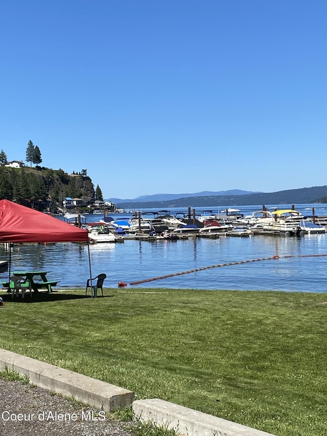 view of water feature featuring a mountain view and a boat dock