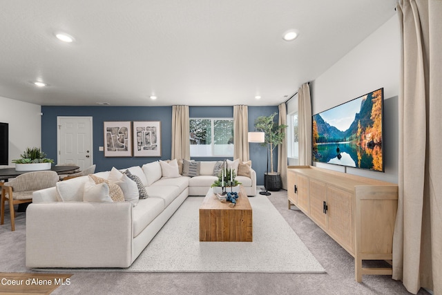 living room featuring light colored carpet