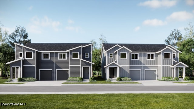 view of front facade featuring a front yard and a garage