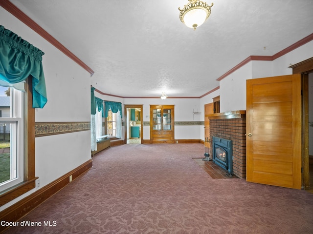 unfurnished living room featuring a textured ceiling, carpet, and crown molding