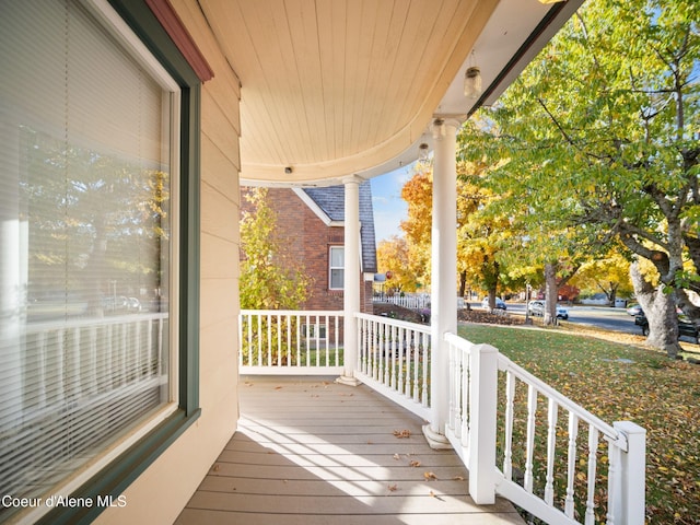 wooden deck featuring covered porch