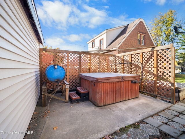 view of patio featuring a hot tub