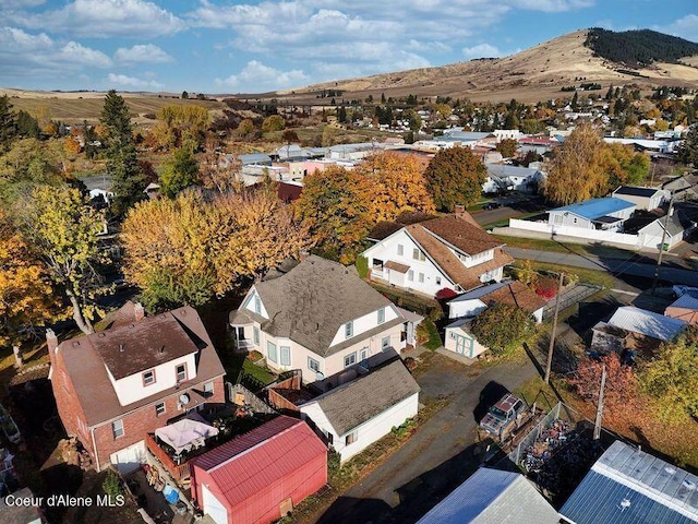 birds eye view of property featuring a mountain view