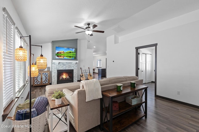 living room with vaulted ceiling, plenty of natural light, dark hardwood / wood-style floors, and ceiling fan