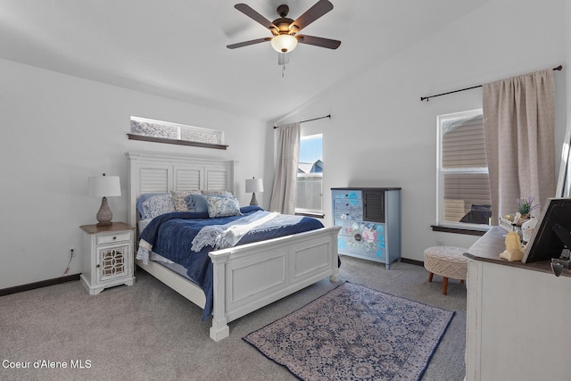 carpeted bedroom with vaulted ceiling and ceiling fan