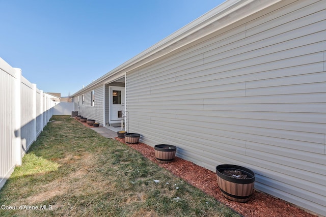 view of property exterior with a yard