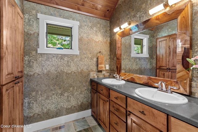 bathroom featuring wooden ceiling, vanity, and vaulted ceiling