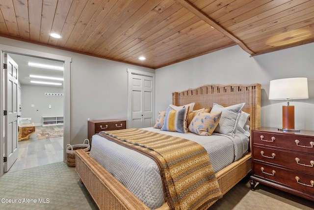 bedroom with light carpet, a closet, and wood ceiling