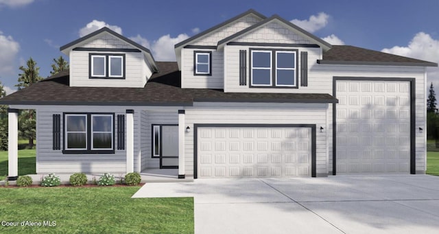 view of front of property featuring a garage and a front yard