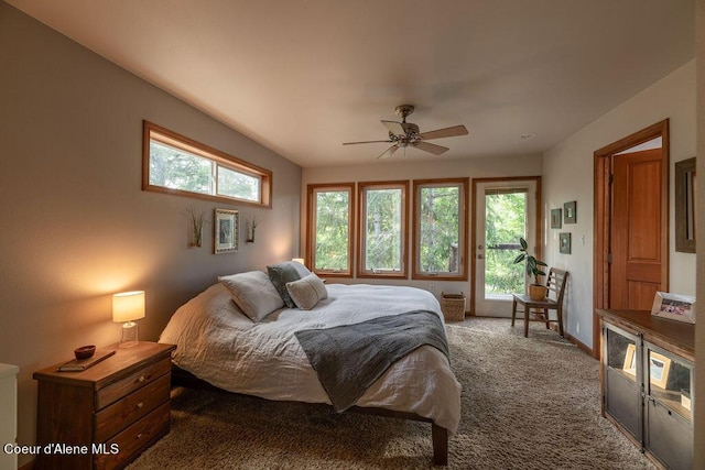 bedroom with ceiling fan and dark carpet