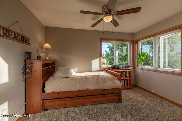 bedroom with ceiling fan and carpet flooring