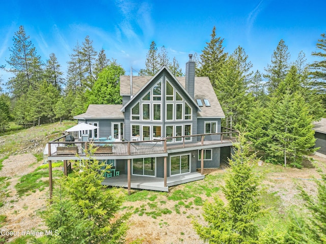 32 Angelina Way, Priest River, ID 83856 - rear view of property featuring a deck and a chimney