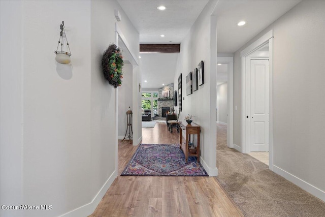 hall with recessed lighting, baseboards, and wood finished floors