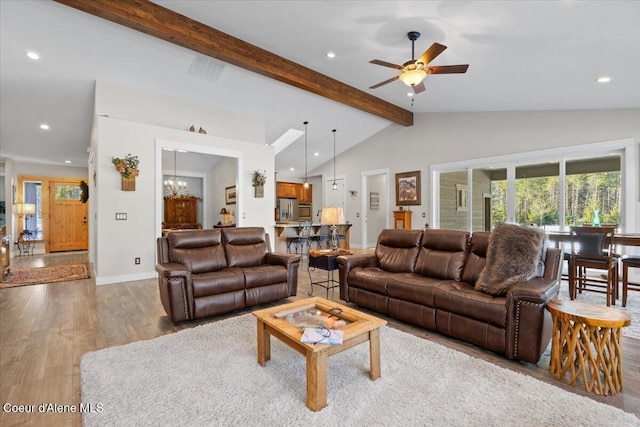 living room featuring vaulted ceiling with beams, ceiling fan with notable chandelier, wood finished floors, and recessed lighting