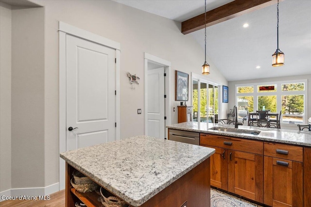 kitchen with lofted ceiling with beams, a kitchen island, a sink, stainless steel dishwasher, and brown cabinetry