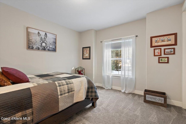 bedroom featuring carpet flooring and baseboards