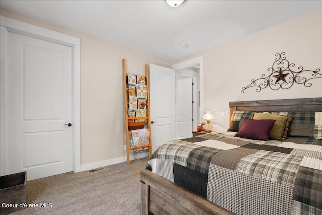 bedroom with carpet, visible vents, and baseboards